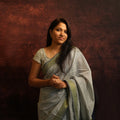 Model wearing Grey Mul Cotton Jacquard Saree with elegant handwoven drape – front view