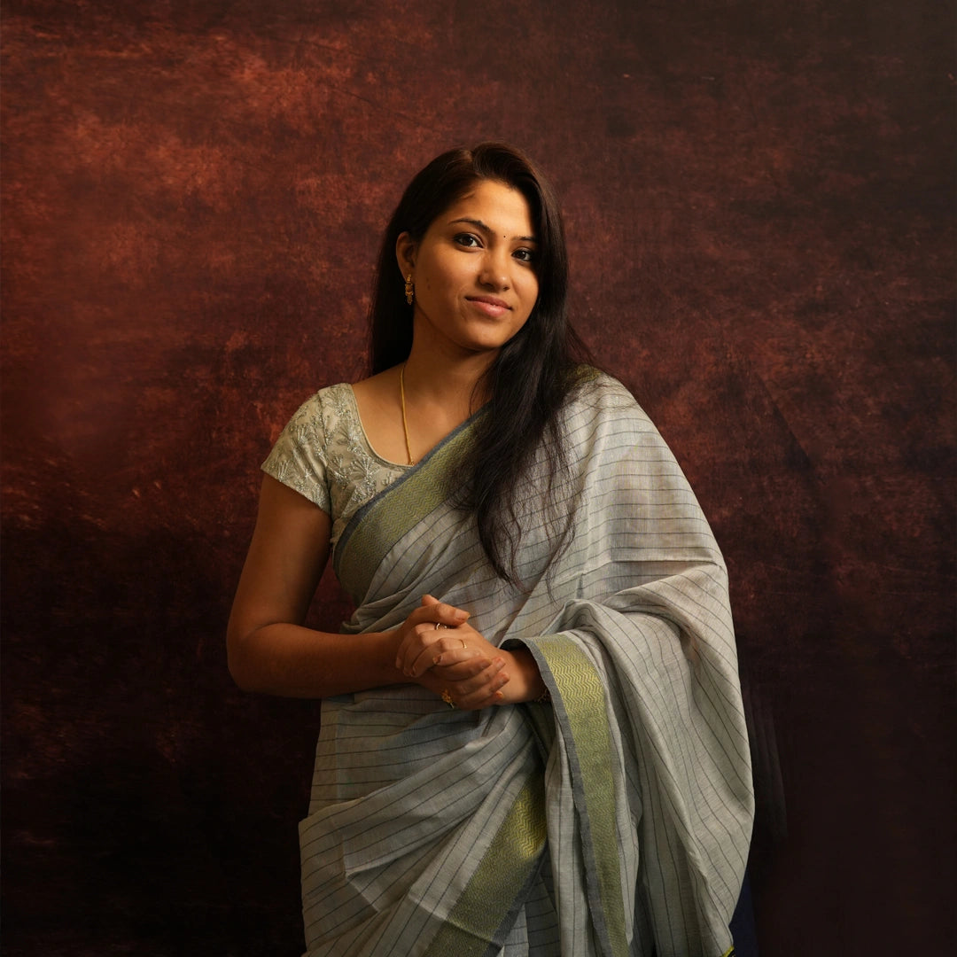 Model wearing Grey Mul Cotton Jacquard Saree with elegant handwoven drape – front view
