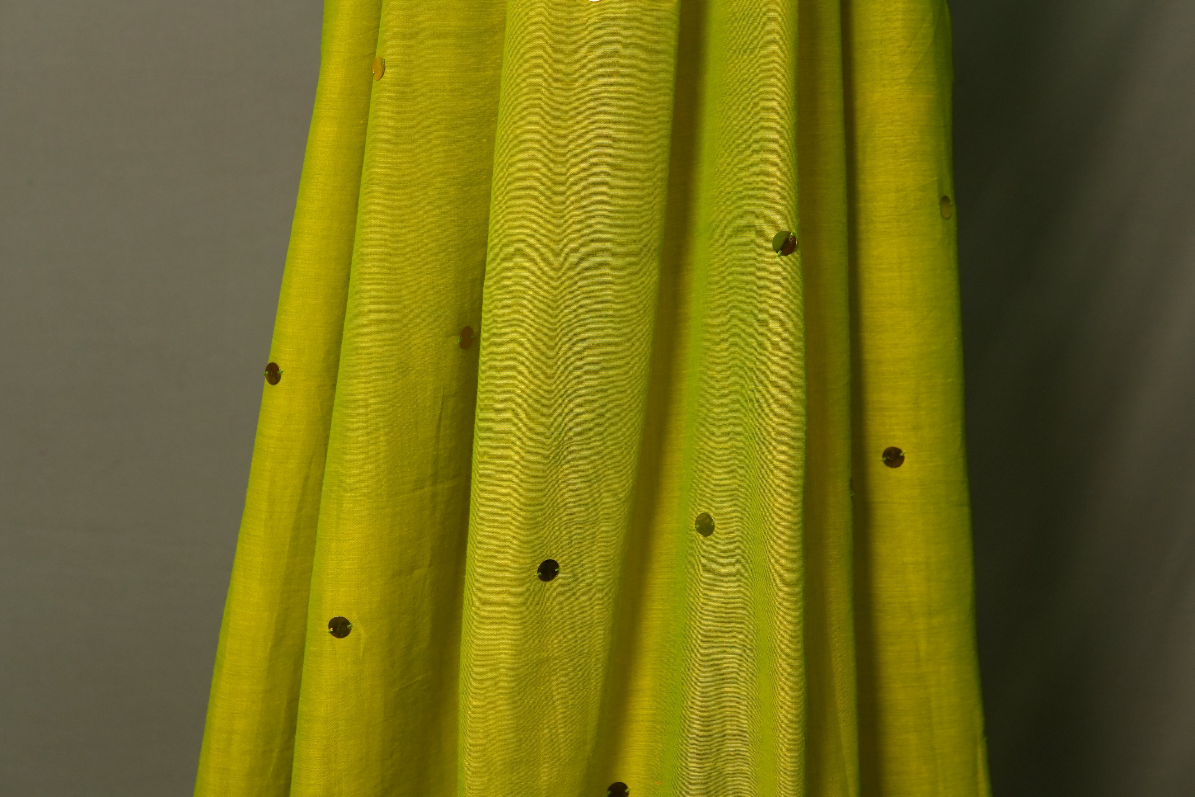 Model posing in light green sequin khadi saree – main character festive saree for Navratri, Diwali and wedding celebrations by Kottanz Loom Co