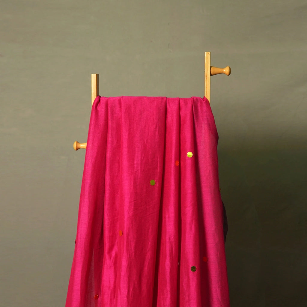 Magenta gini khadi handwoven saree with multicolor sequins on hanger – sustainable festive cotton saree for Navratri and Diwali by Kottanz Loom Co