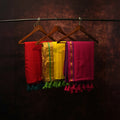 Set of 3 handloom cotton sarees in red, yellow and pink with golden zari border and tassel pallu